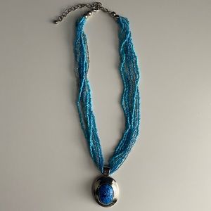 Multi- Strand Beaded Necklace w/ Statement Pendant